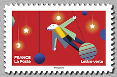 Image du timbre Ours blanc se balançant sur une boule de noël